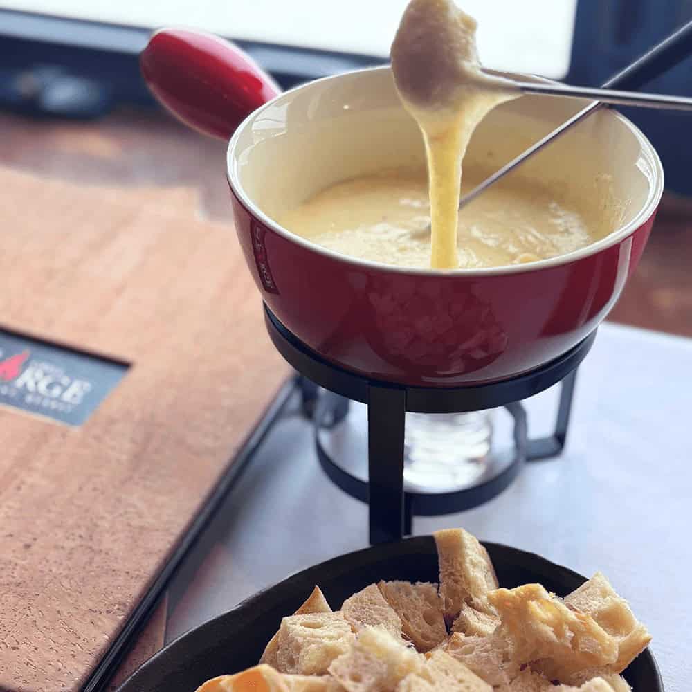 Cheese fondue with bread cubes in Tremblant's pedestrian village.