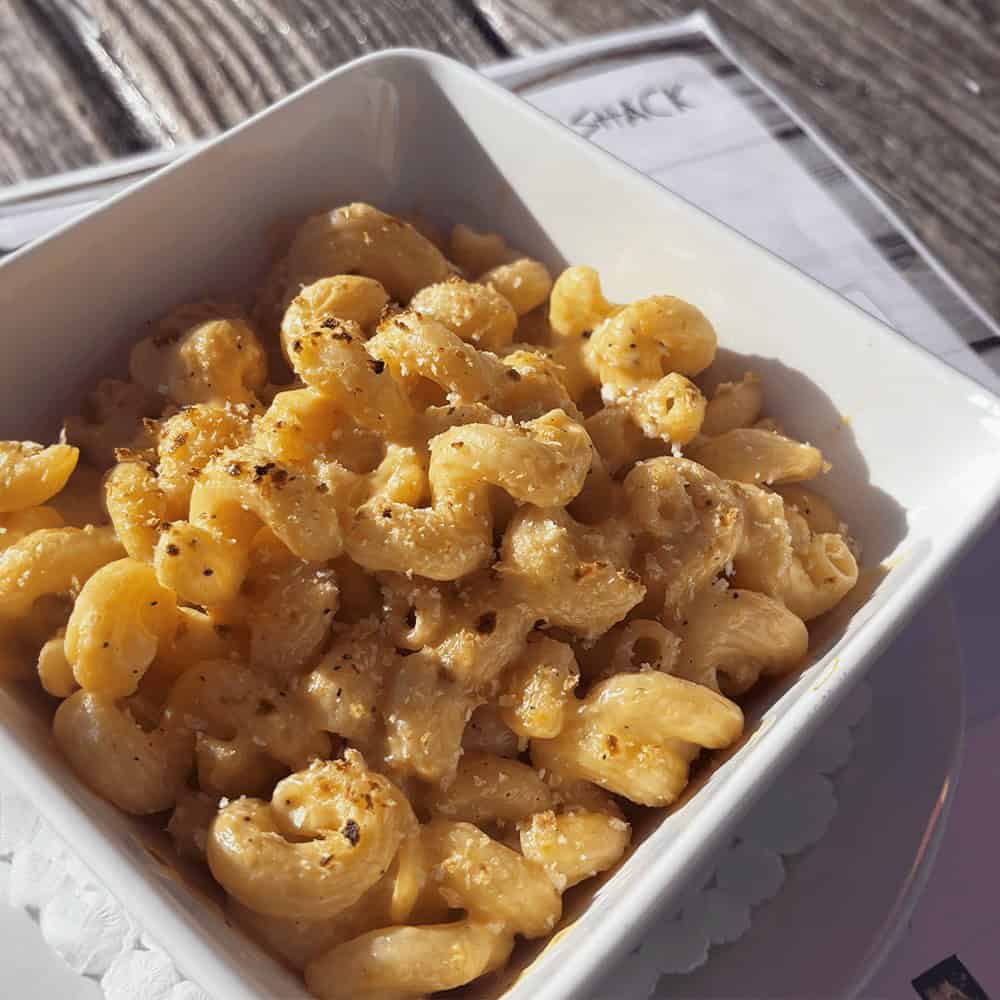 Creamy macaroni and cheese served in a white bowl in Tremblant.