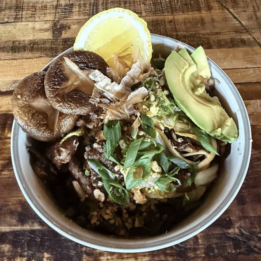 Healthy mushroom, avocado, and lemon bowl for a nutritious meal.