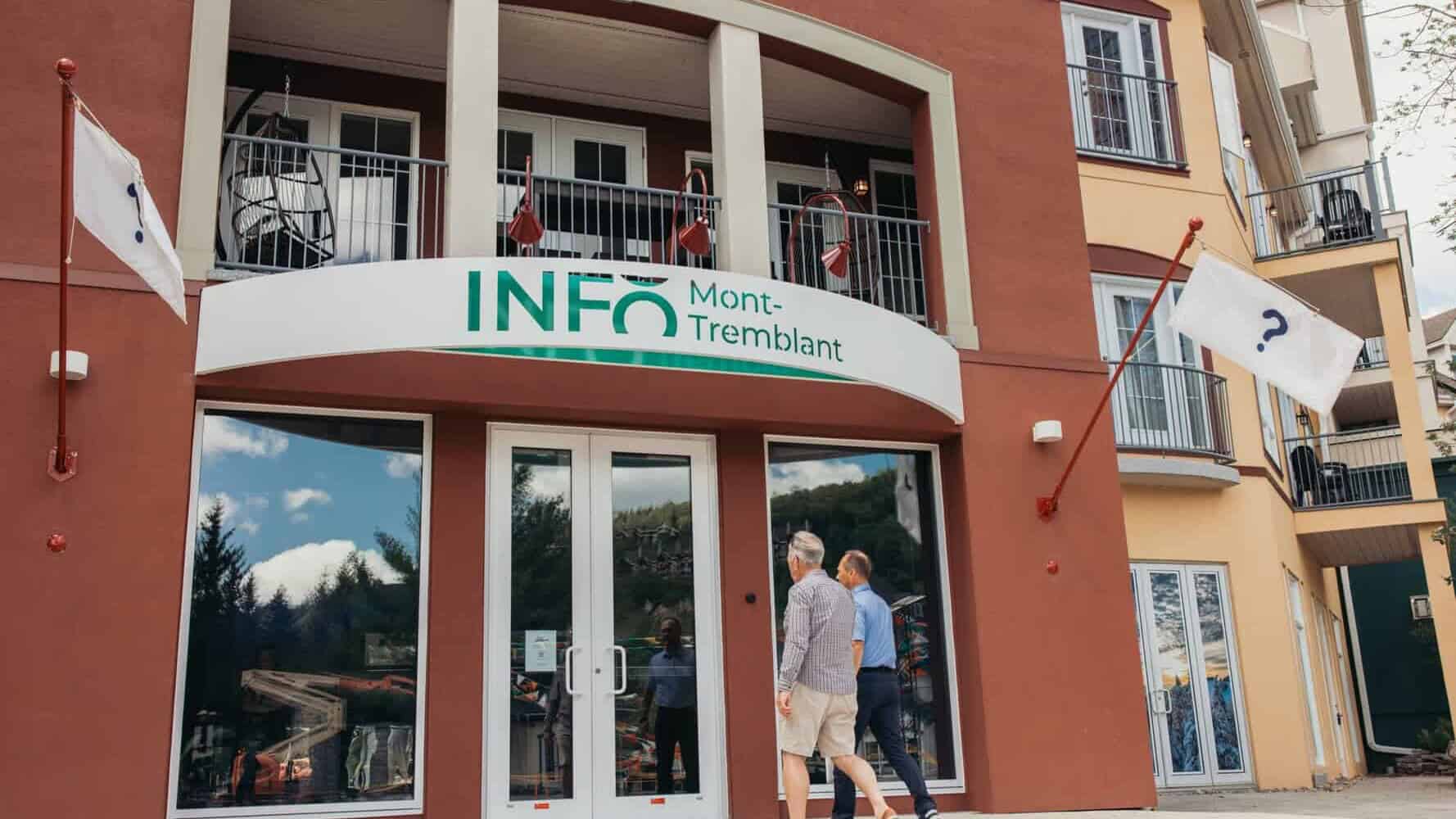 INFO Mont-Tremblant building entrance with people walking in front.