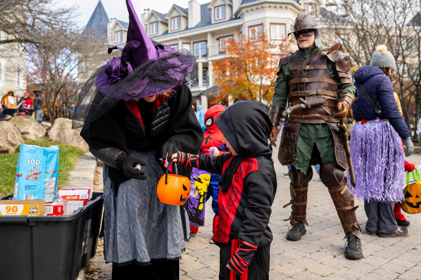 People in Halloween costumes in Tremblant’s village in autumn.
